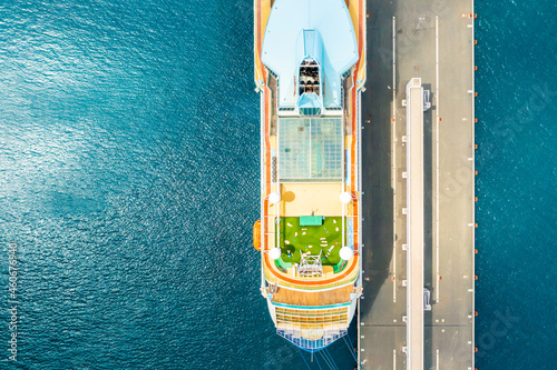 Top view of luxury cruise ship with golf field on the roof at anchor moored in marina on the blue water of Adriatic Sea.  © vladim_ka