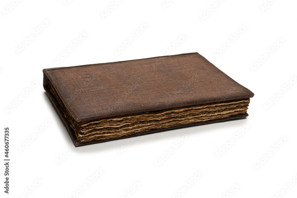 An old brown book isolated on white background. An old brown book isolated on white background.