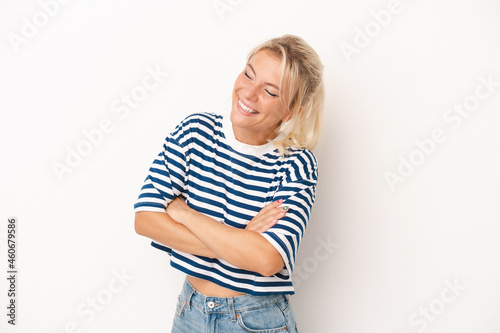 Young Russian woman isolated on white background smiling confident with crossed arms.