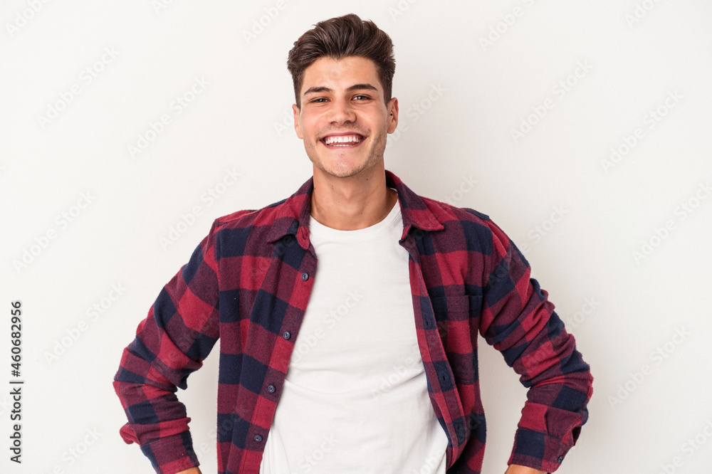 Young caucasian man isolated on white background confident keeping hands on hips. Young caucasian man isolated on white background confident keeping hands on hips.