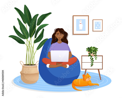 Woman is sitting on a bean bag chair at home at a laptop computer. Remote work, office at home, programming, freelance. Study at home in quarantine. Vector illustration. Cozy interior with a cat.