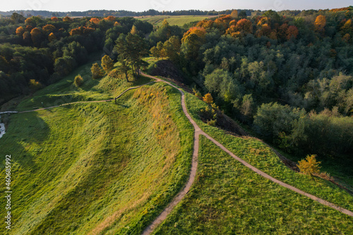 Top of the baltic mound with beautiful colors of autumn photographed with a drone on sunny day. Regional park of neris in Lithuania. Dukstai educational trail. Real is beautiful 