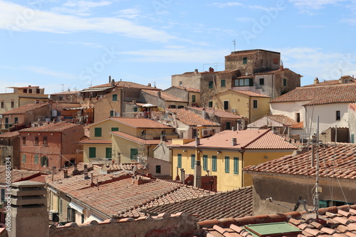 Elba, Italy – September 02, 2021: beautiful places from Elba Island. Aerial view to the island. Little famous villages near the beaches. Summer tourist places. Clouds and blue sky in the background.