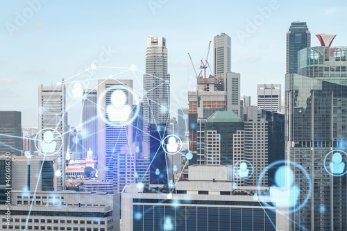 Social media icons hologram over panorama city view of Singapore, Asia. The concept of people networking, connections and career opportunities. Double exposure.