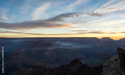 Light sky and dark land. Beginning of a day in the Grand Canyon
