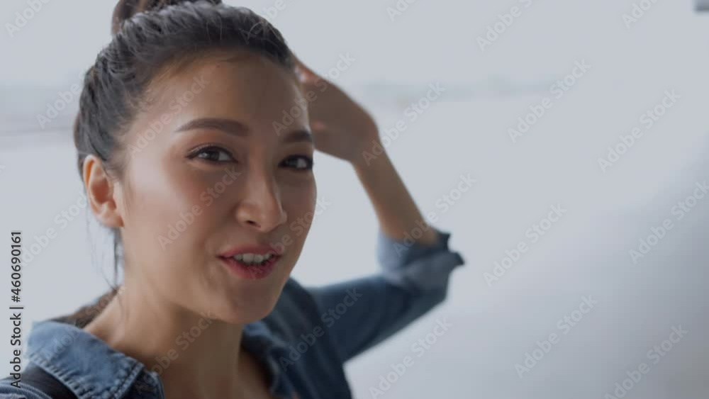 attractive asian female woman wearing casual travel cloth hand smartphone video call show surrounding sight seeing of airport walking path,asian female video call to say goodbye before flight travel attractive asian female woman wearing casual travel cloth hand smartphone video call show surrounding sight seeing of airport walking path,asian female video call to say goodbye before flight travel
