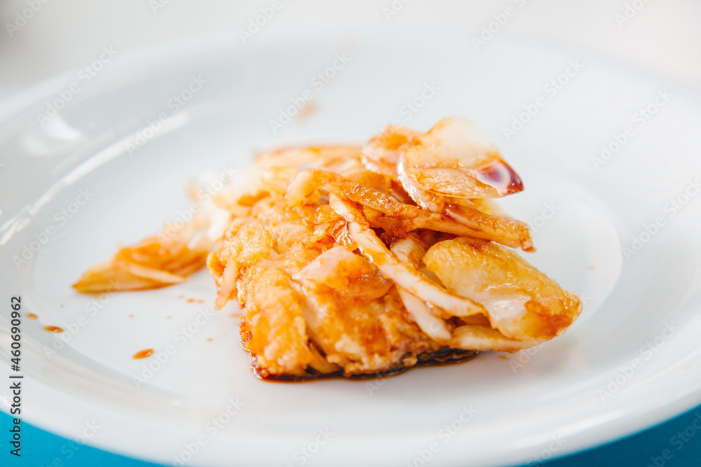 Mediterranean food concept. Fried fish on the white plate. Mediterranean food concept. Fried fish on the white plate.