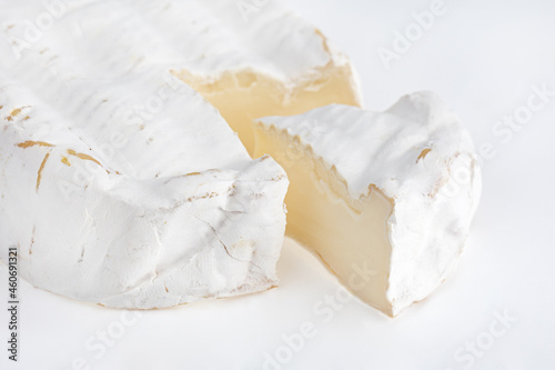 Camembert on a white background. Camembert cheese close-up on a white background.