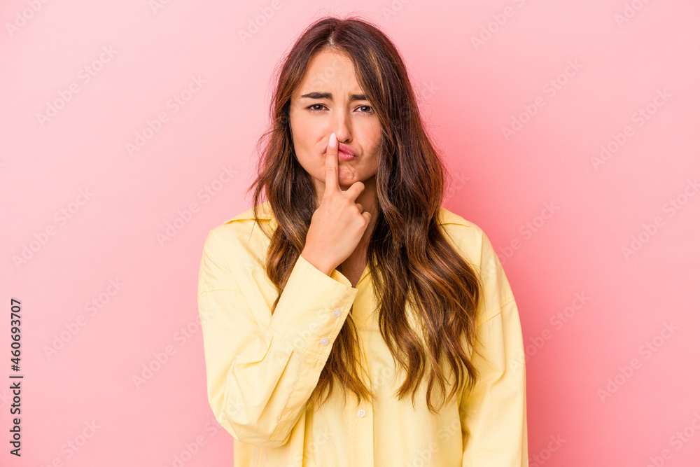 Young caucasian woman isolated on pink background thinking and looking up, being reflective, contemplating, having a fantasy. Young caucasian woman isolated on pink background thinking and looking up, being reflective, contemplating, having a fantasy.