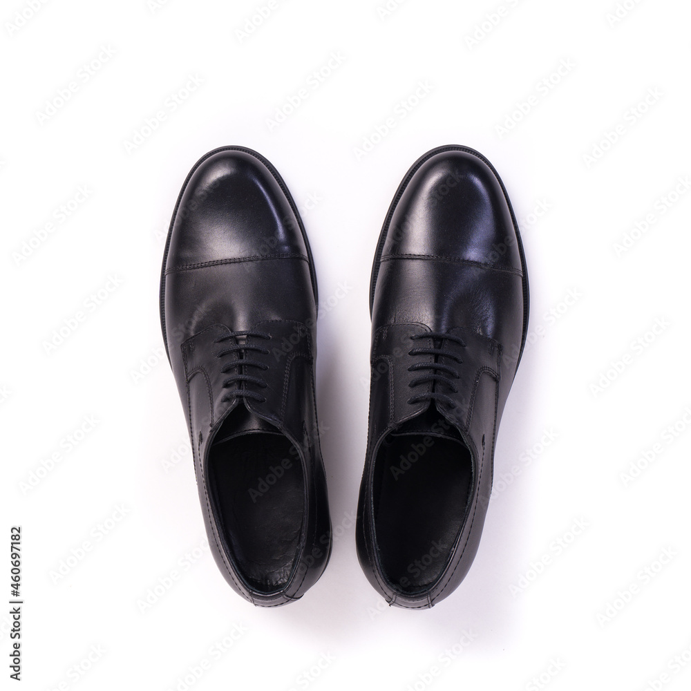 top view pair of men's elegant black leather shoes isolated on white background