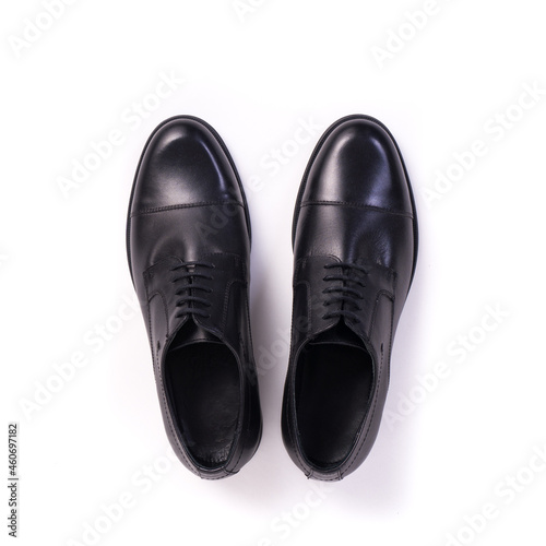 top view pair of men's elegant black leather shoes isolated on white background