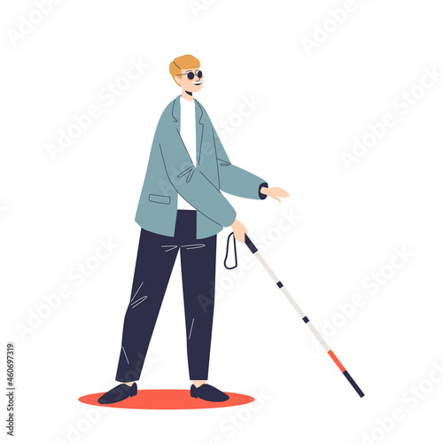 Young blind man in sunglasses move with walking stick. Male with disability and eyesight disease