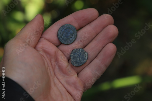 Ancient Roman coin in hand