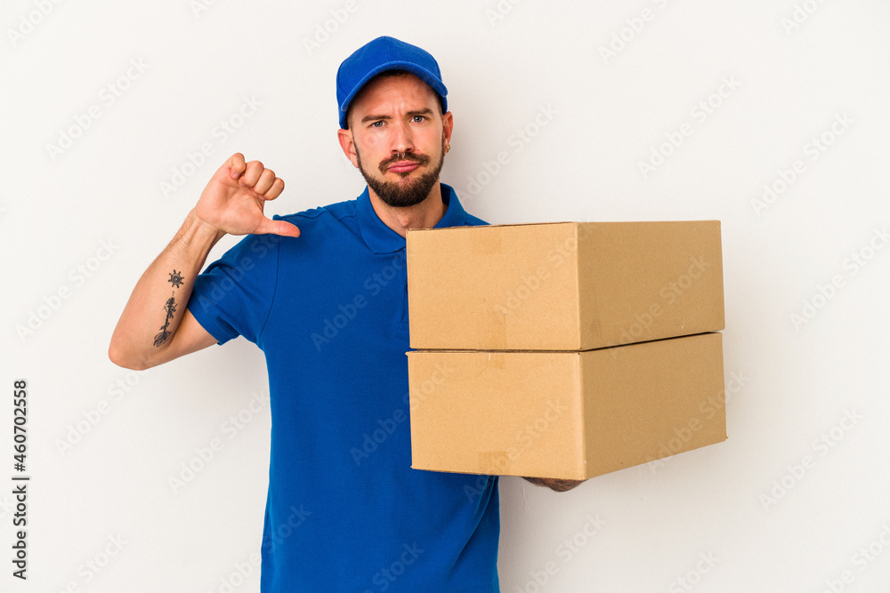 Young caucasian delivery man with tattoos isolated on white background  feels proud and self confident, example to follow.