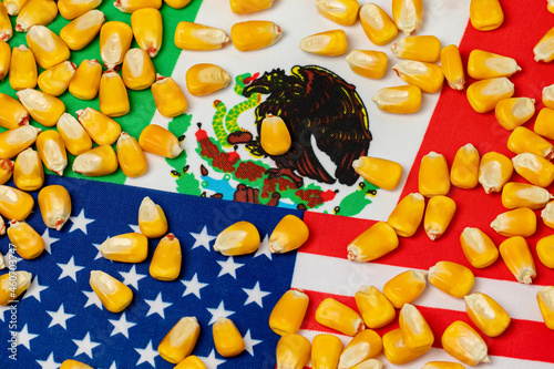 United States of America, Mexico flags and corn kernels. Agriculture trade agreement, imports and exports concept. photo