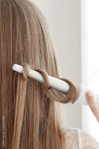 Female hair and curler, close up