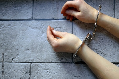 Image of women's hands in handcuffs