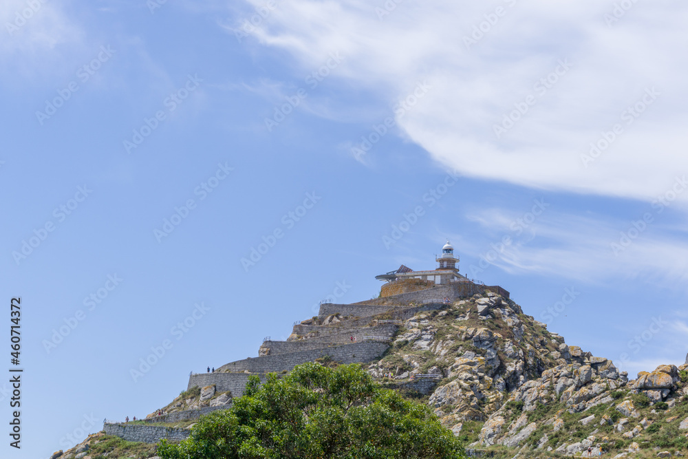 Low angle view of Monte del Faro, with the Cíes Islands Lighthouse on the highest part of the mountain. In the Cíes Islands, Pontevedra, Galicia, Spain.