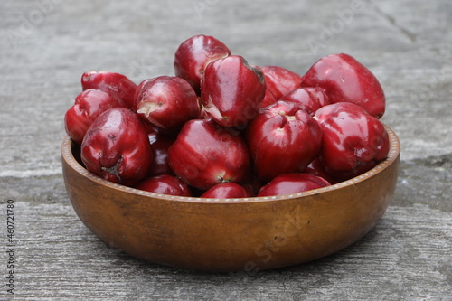Pile of jambu or Rose apple also known as Syzygium Malaccense in a wooden bowl photo