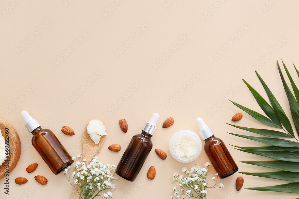 Bottles of almond essential oil on light background Bottles of almond essential oil on light background
