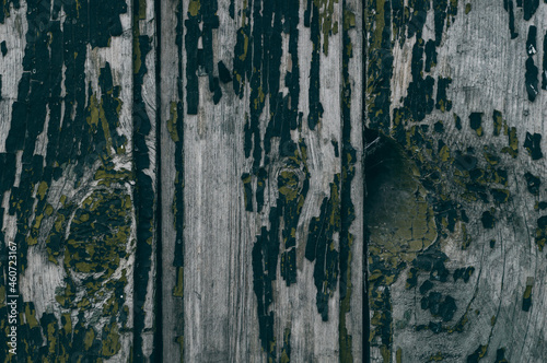 Close-up of old wooden boards with peeling paint. Textured surface. Background