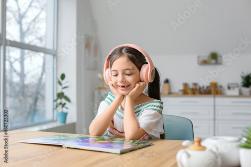 Little girl with headphones...