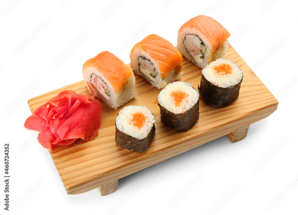 Wooden board with delicious sushi rolls, maki and ginger on white background Wooden board with delicious sushi rolls, maki and ginger on white background