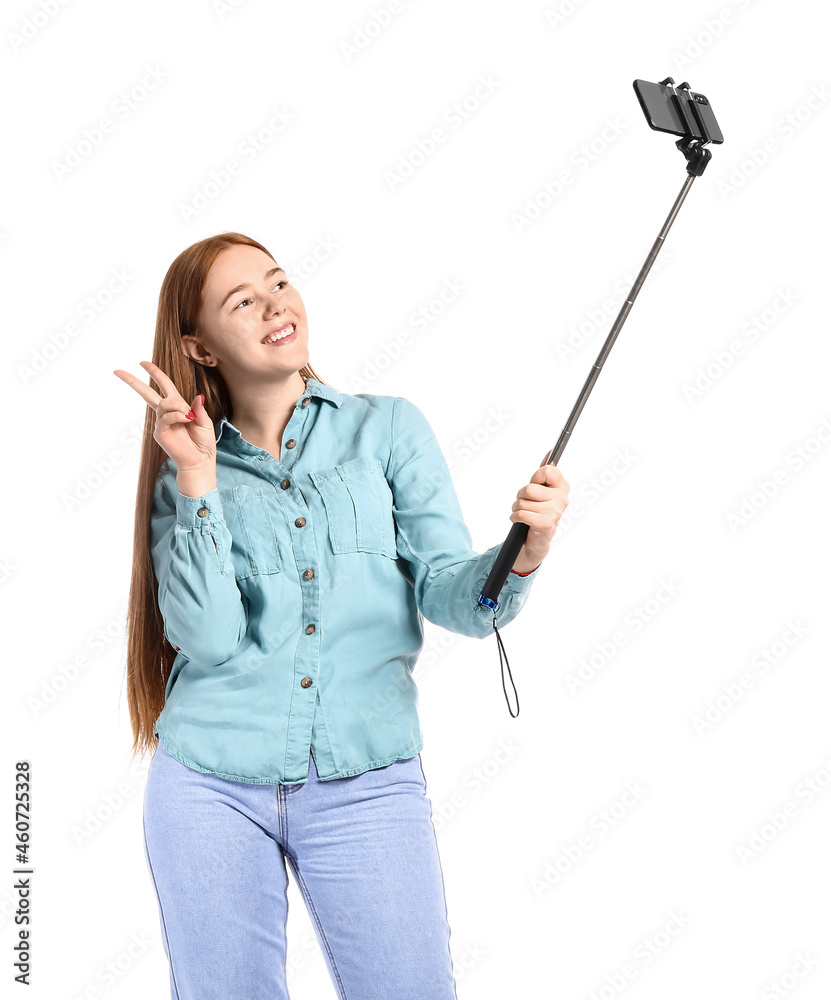 Young woman taking selfie on white background Young woman taking selfie on white background