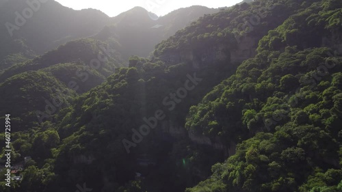 Aztec jungle pyramid in Malinalco Mexico. Flying into the jungle.  photo