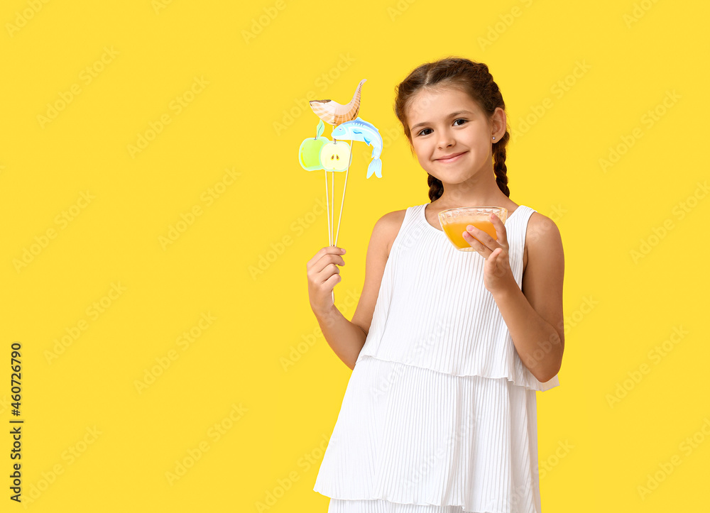 Little girl with decor for Rosh Hashanah (Jewish New Year) and honey on color background Little girl with decor for Rosh Hashanah (Jewish New Year) and honey on color background