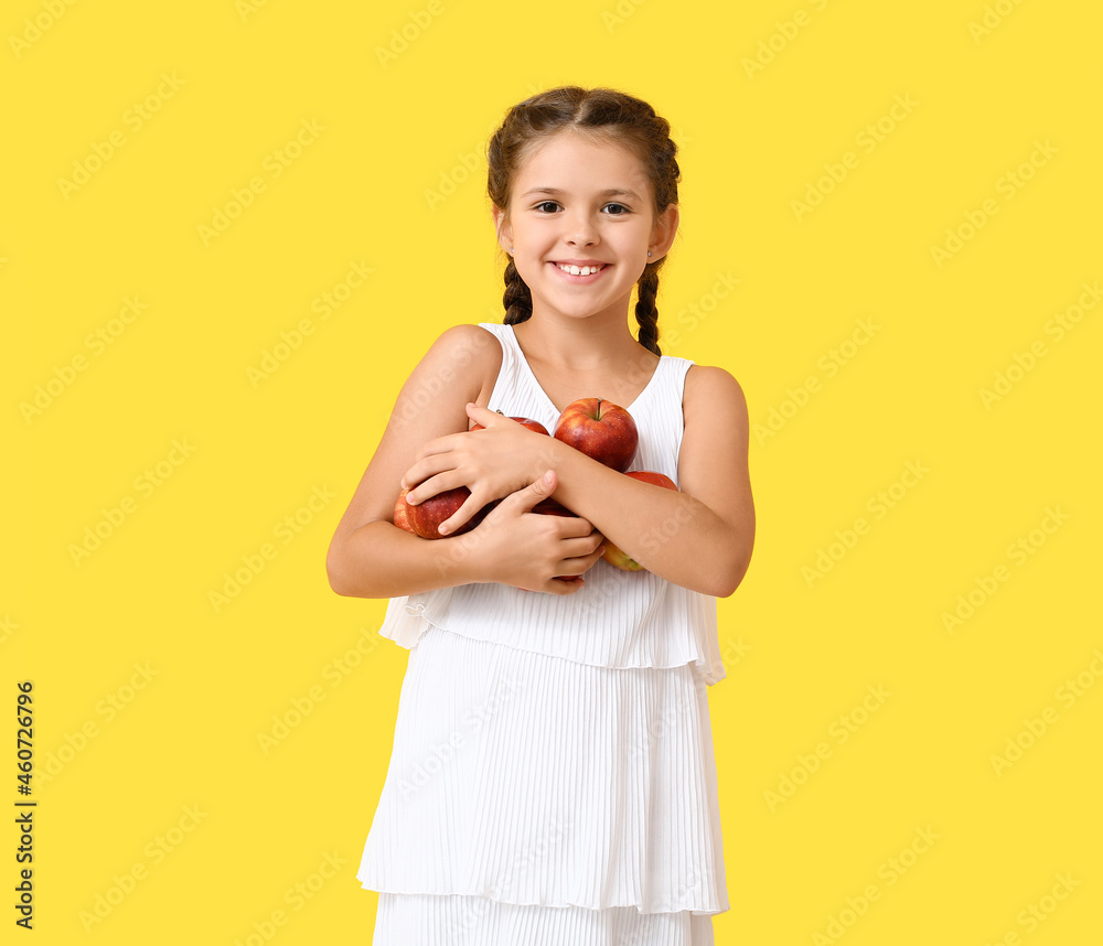 Little girl with apples on color background Little girl with apples on color background