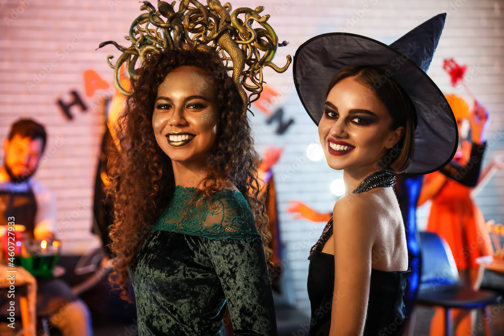 Young women having fun at Halloween party Young women having fun at Halloween party