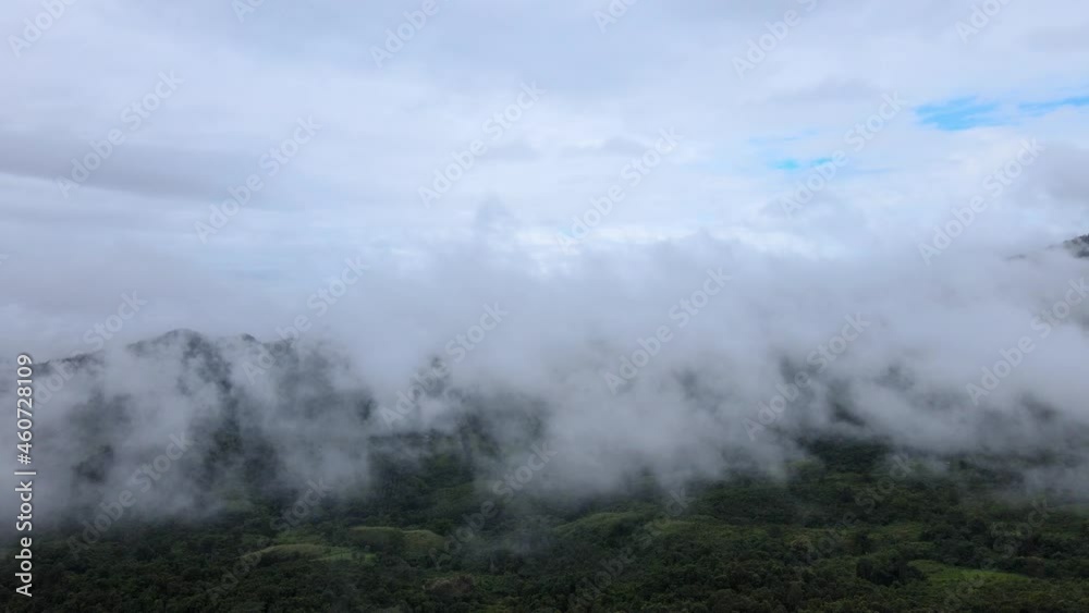 Aerial drone shot panoramic view, flying forward fresh green mountain range with morning fog natural background, Northern Thailand. Aerial drone shot panoramic view, flying forward fresh green mountain range with morning fog natural background, Northern Thailand.