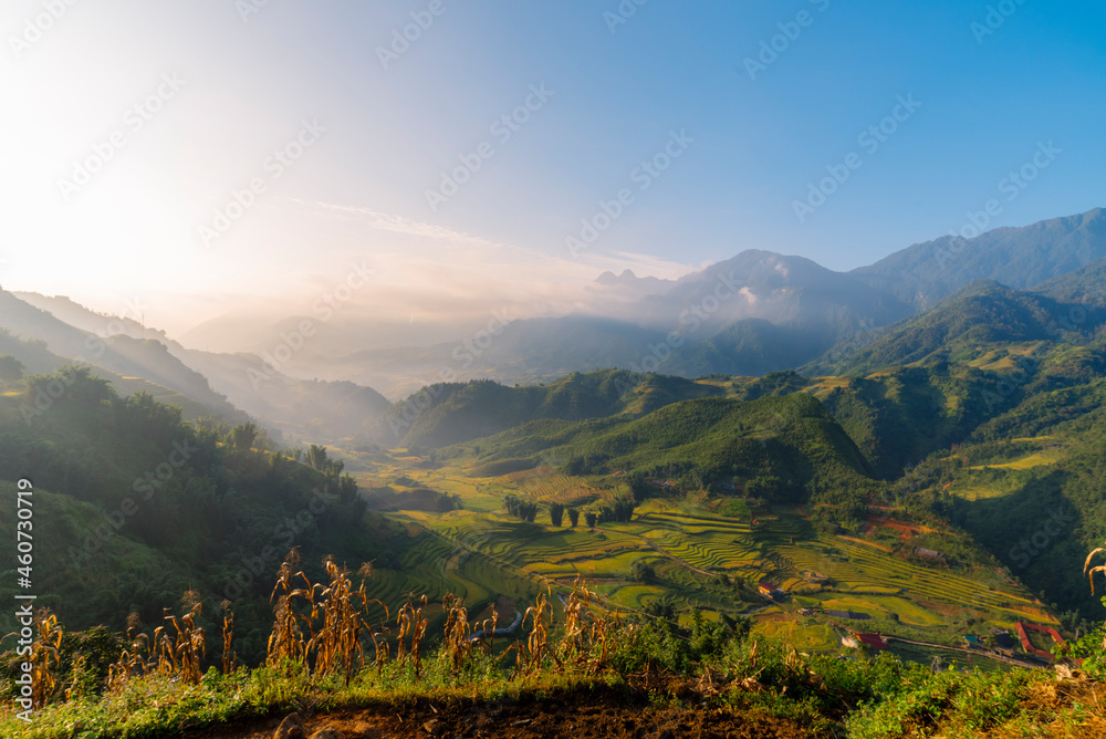 Naklejka premium Beautiful Mountain landscape foggy windy mountain range green landscape asian farm. Amazing Landscape mountain green field meadow white cloud blue sky on sunrise. Countryside sunlight heaven scenery