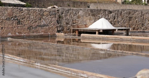 Pile Of Salt Drying Under The Sun At The Salt Pan Of Salinas de Rio Maior In Portugal. static photo