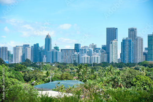 Manila, Philippines - Feb 02, 2020. View of the city of Manila from the pool of the luxury five-star Discovery Primea hotel. Sunny weather. Skyscrapers on the background.