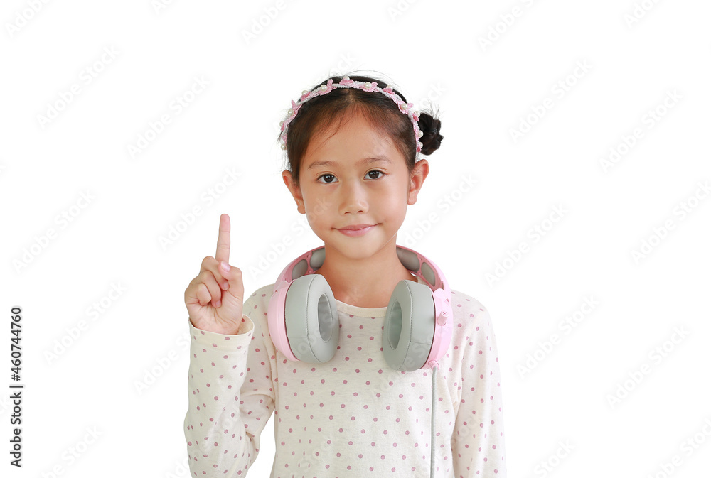 Portrait of Asian young girl kid with headphones on neck show one forefinger isolated on white background. Portrait of Asian young girl kid with headphones on neck show one forefinger isolated on white background.