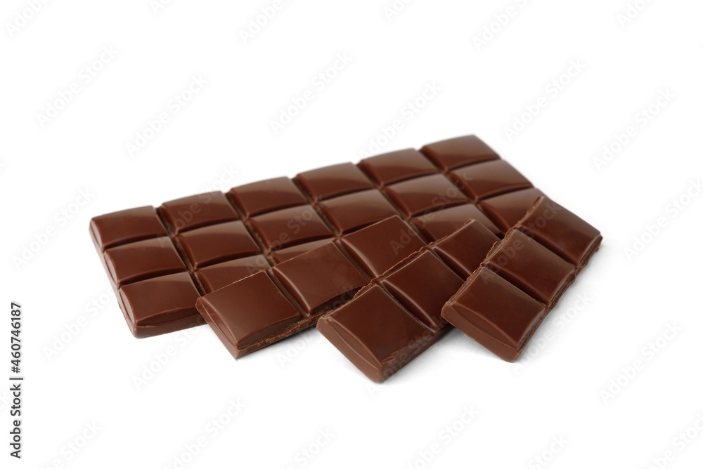 Milk chocolate pieces isolated on white background. Milk chocolate pieces isolated on white background.