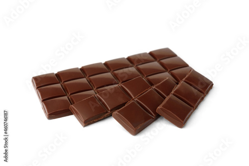 Milk chocolate pieces isolated on white background.