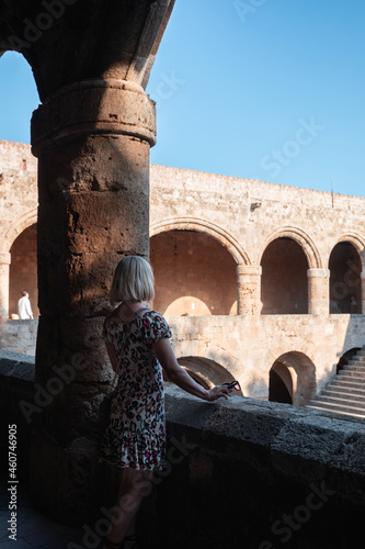 Woman visits the Museum of Archeology on the island of Rhodes, Greece