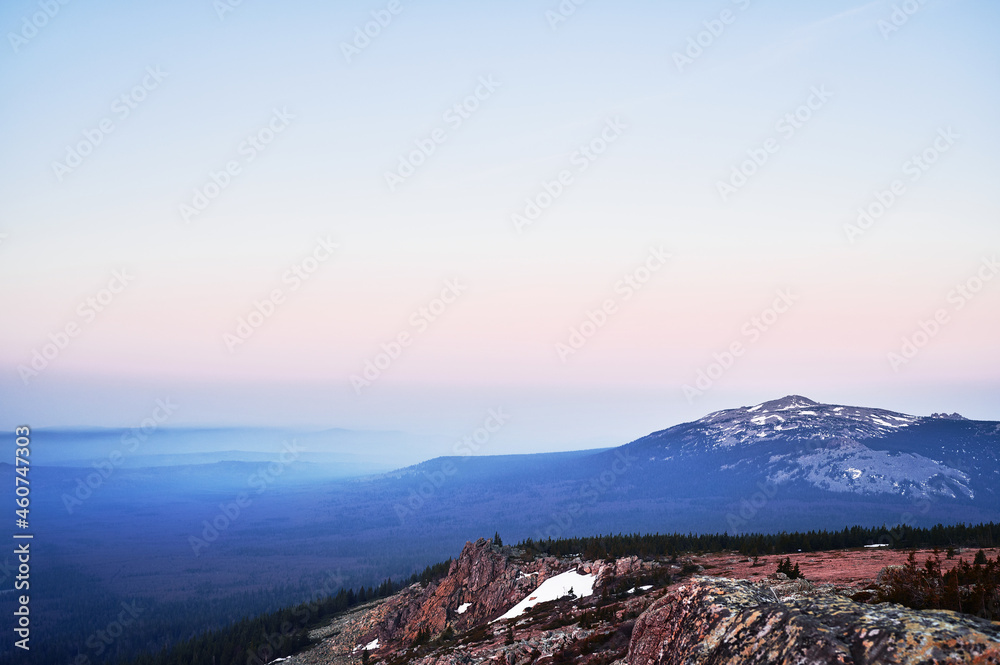 Rocky mountain peaks at the horizon