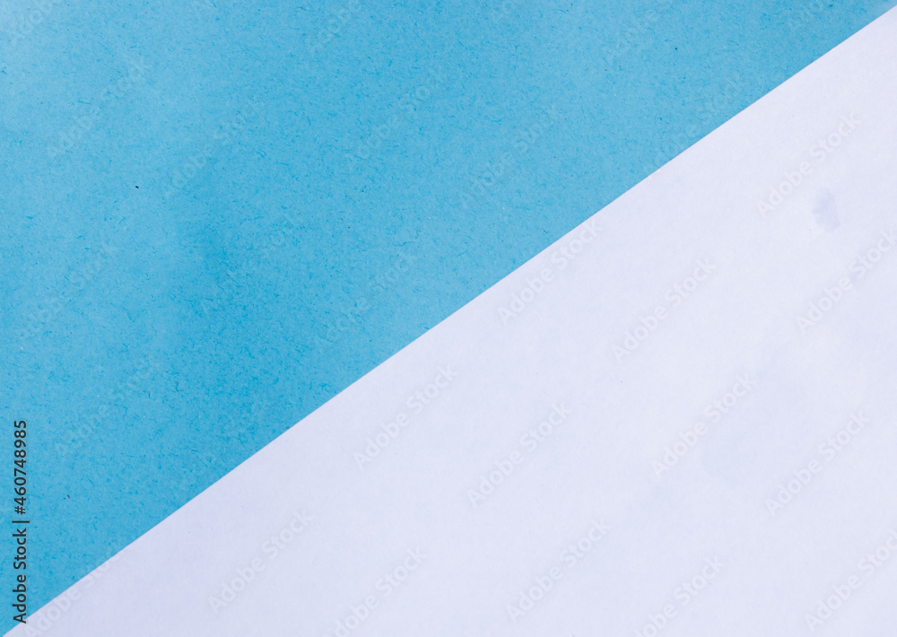 Two color paper with blue and white of the image. texture of colored paper. Trendy colors for design. Abstract geometric background. Two color paper with blue and white of the image. texture of colored paper. Trendy colors for design. Abstract geometric background.