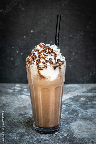 Coffee with Ice cream, milk and chocolate on abstract background.