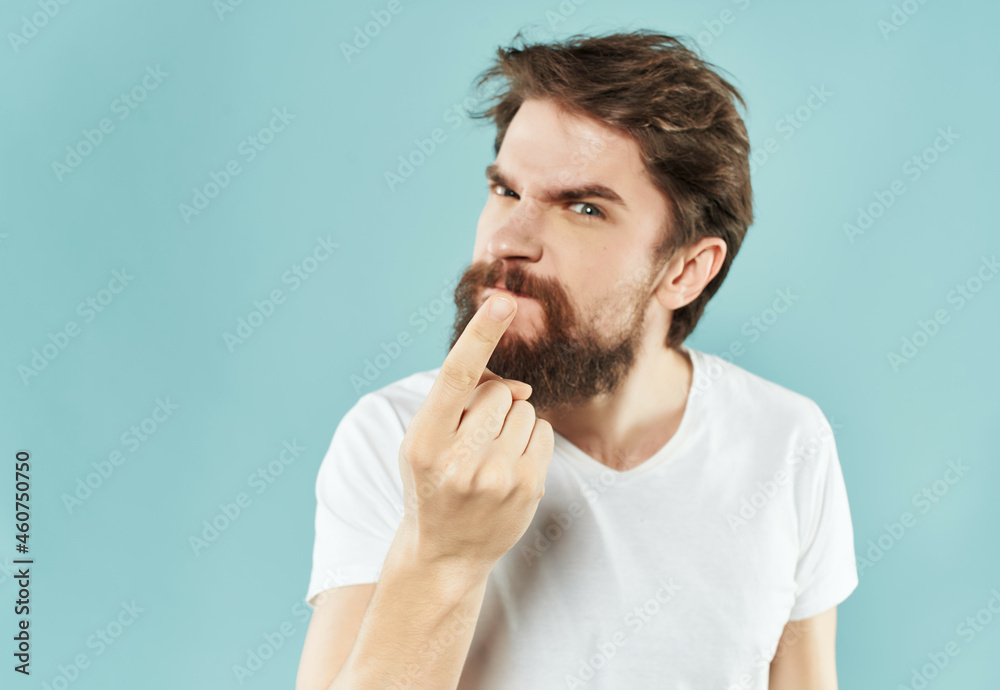 Man in a white t-shirt expressive look discontent Lifestyle Man in a white t-shirt expressive look discontent Lifestyle
