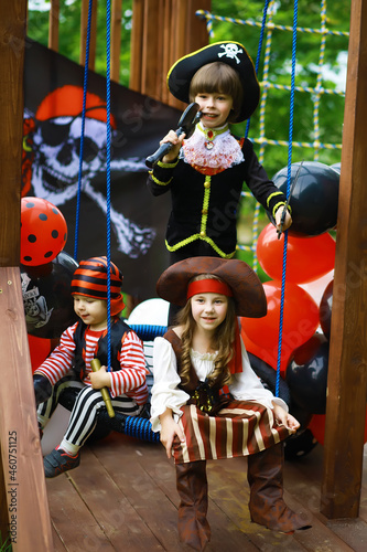 Children's party in a pirate style. Children in pirate costumes are playing on Halloween.