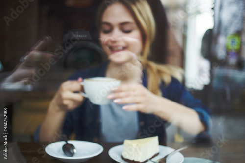 beautiful woman a cup of coffee in a cafe snack breakfast