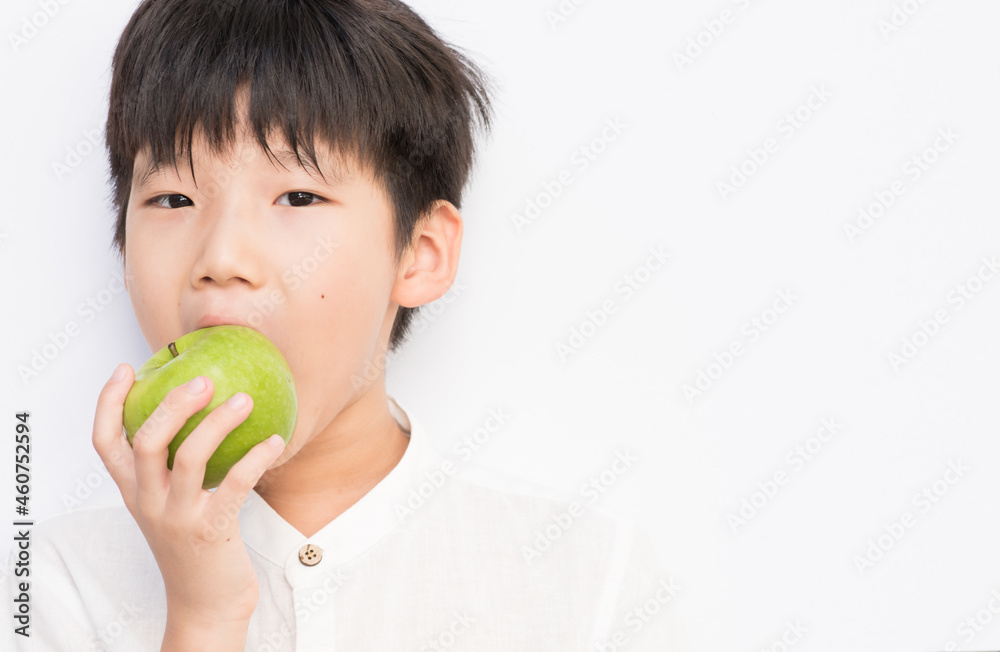 little boy holding green apple. little boy holding green apple.