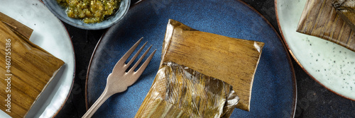 Tamale panorama, traditional dish of the cuisine of Mexico, various stuffings wrapped in green leaves. Hispanic food, shot from above photo