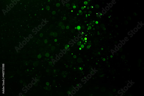 green bokeh natural with black background © pandaclub23