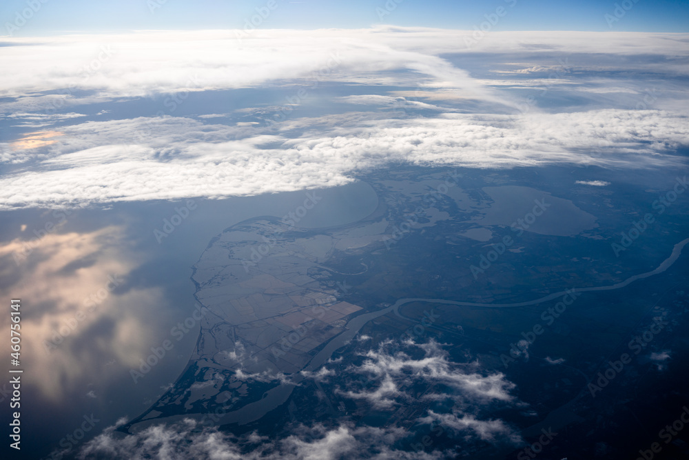 Naklejka premium Aerial view of the mouth of the Rhone River in France from an airplane window 